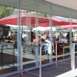 Frameless glass facade installed at Royal Festival Hall by Open Entrances.